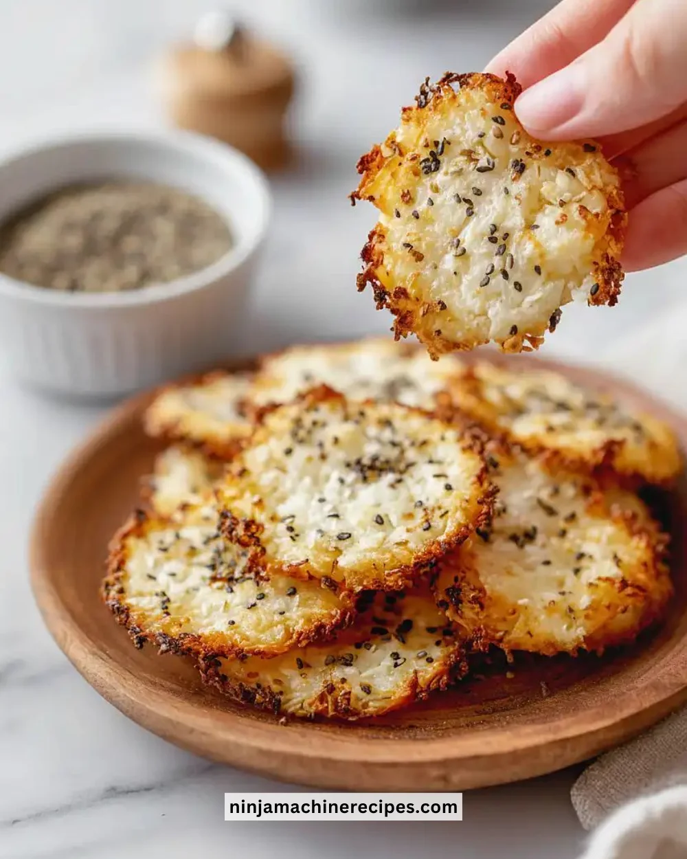 Bowl of homemade cottage cheese chips, crispy and healthy snack option