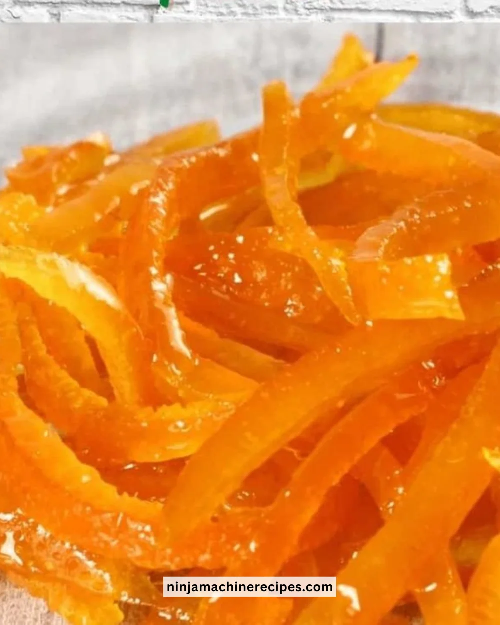 Italian candied orange peels on a wooden plate