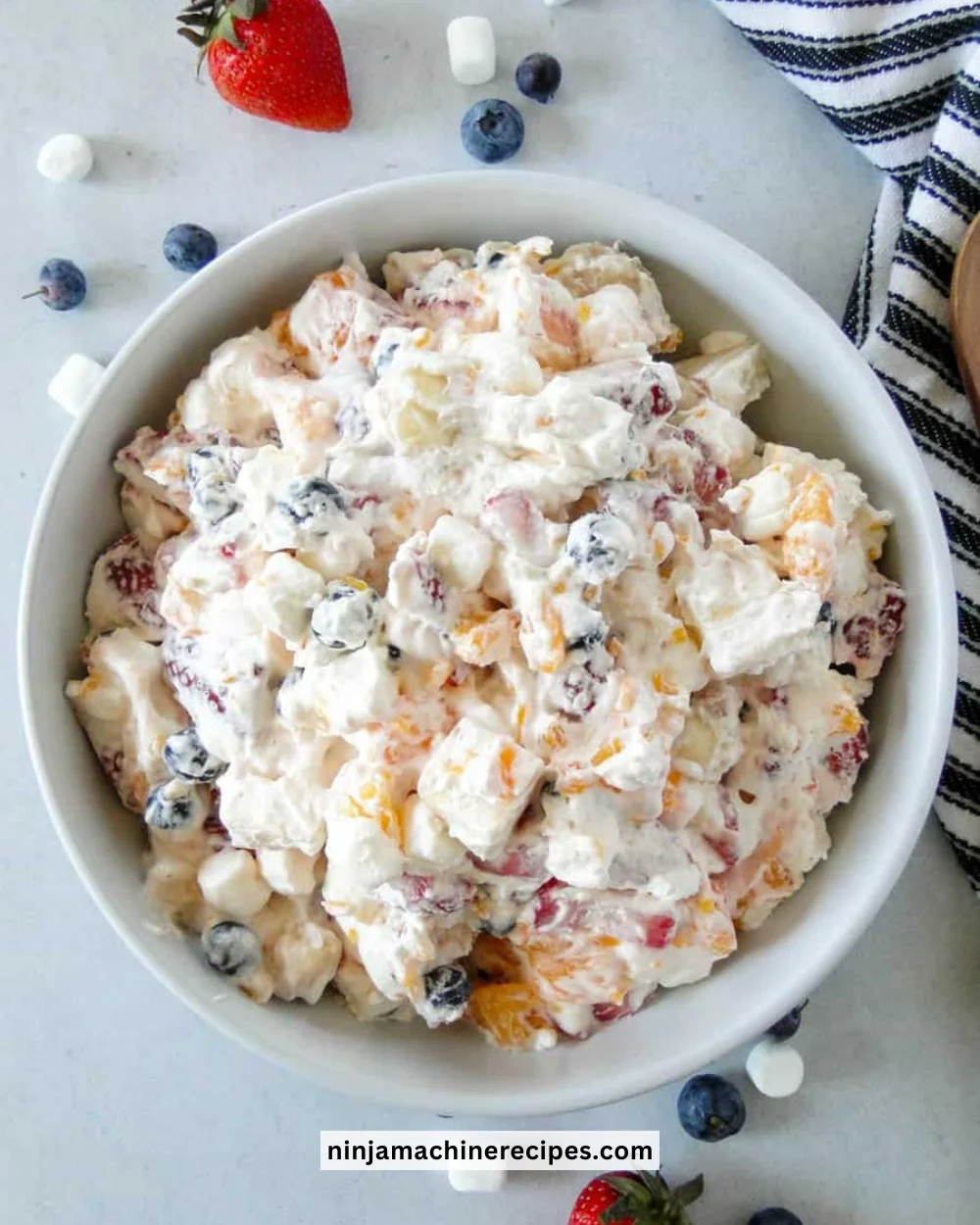 Mom’s Creamy New York Fruit Salad featuring colorful mixed fruits and creamy dressing