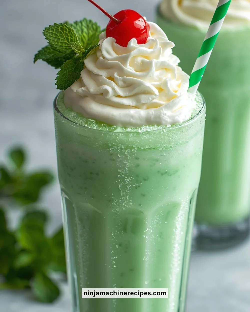 Ninja Slushie Shamrock Shake featuring vibrant green color and whipped cream.