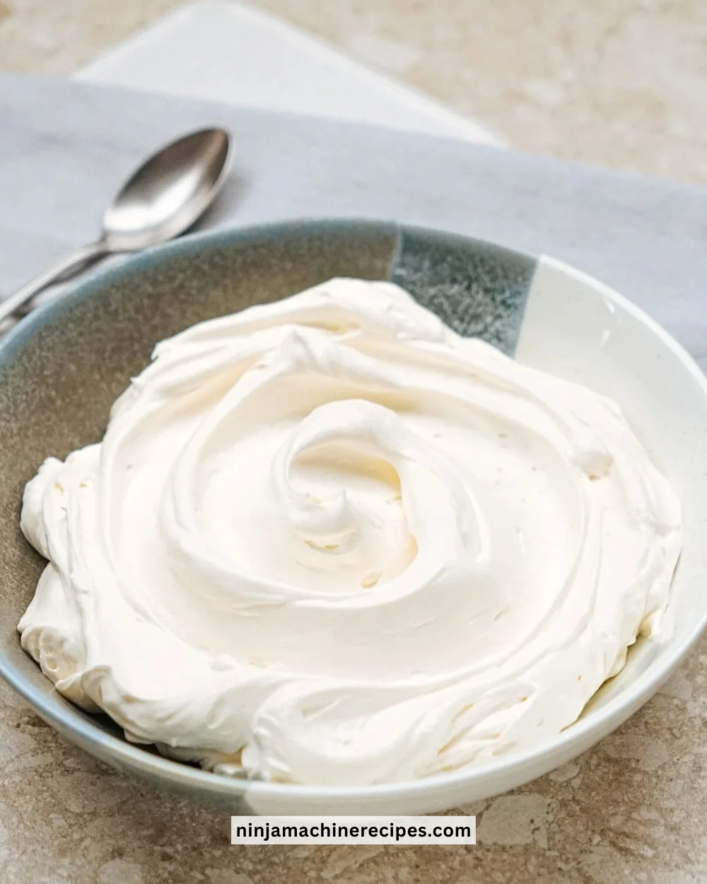 Delicious no-bake cheesecake filling in a mixing bowl, ready for dessert recipes.