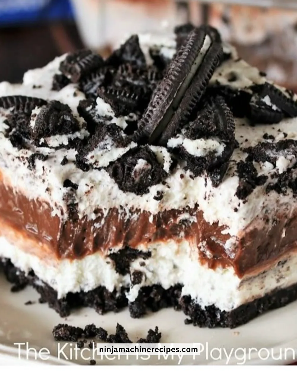 No-Bake Oreo Yum Yum dessert with layers of cream and crushed Oreos