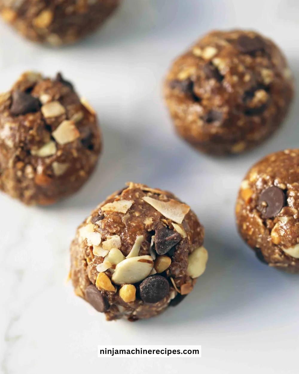 No-bake protein energy balls made with oats, nut butter, and chocolate chips.