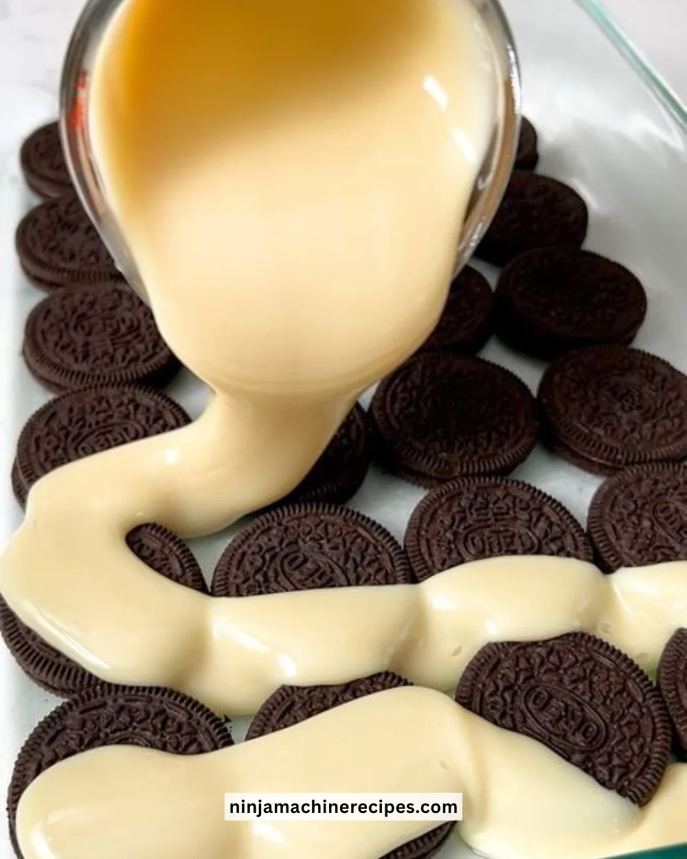 Delicious Oreo Dump Cake topped with crushed Oreos and whipped cream