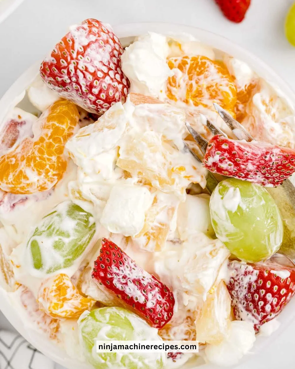 Pudding Fruit Salad with colorful fruits and creamy pudding topping