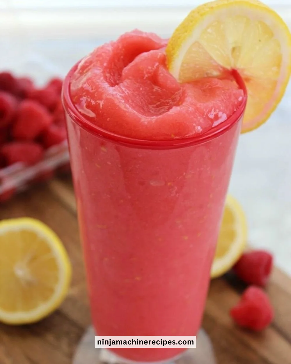 Refreshing Raspberry Lemonade Slushie with vibrant colors in a chilled glass