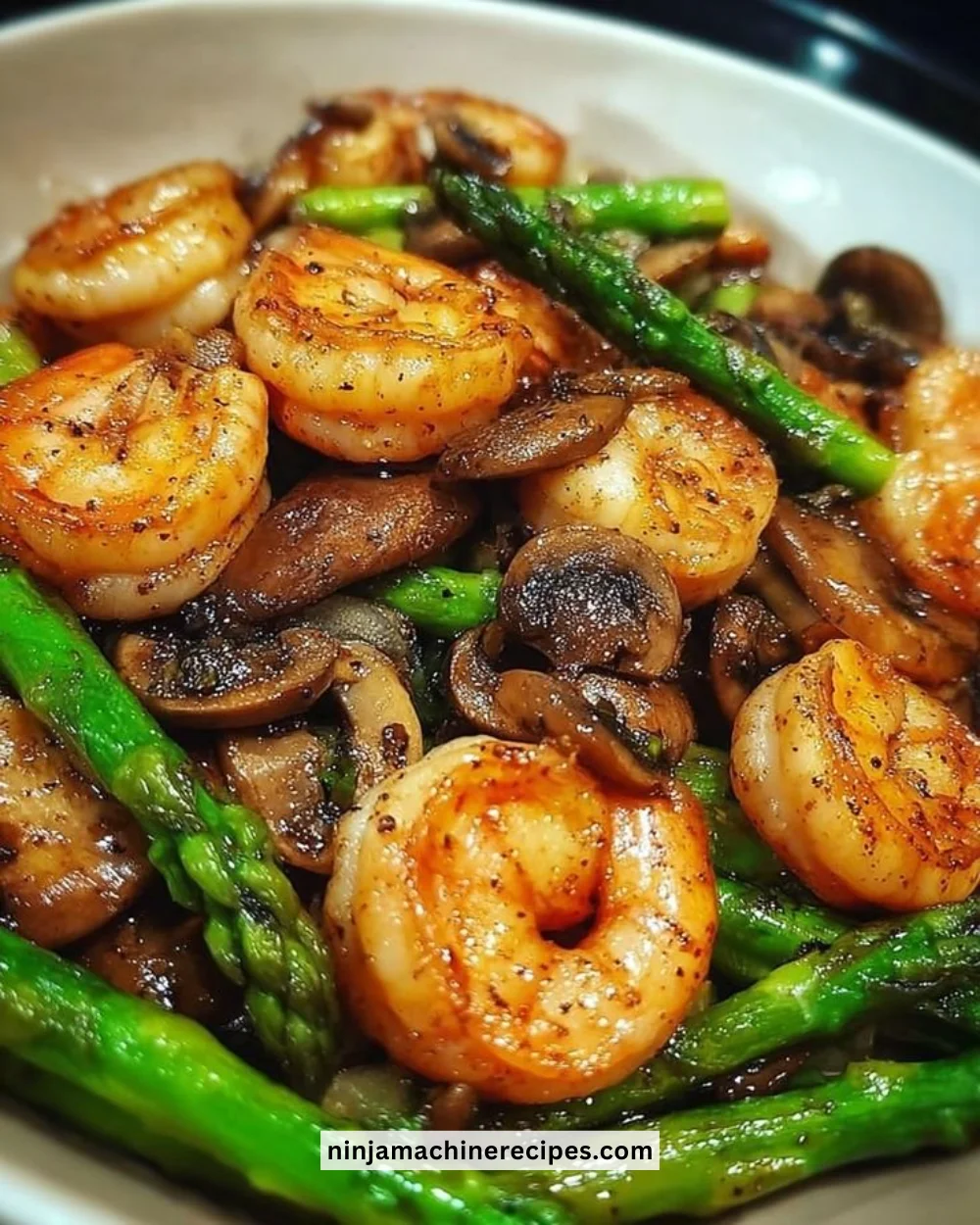 Delicious shrimp asparagus stir-fry with mushrooms served in a bowl