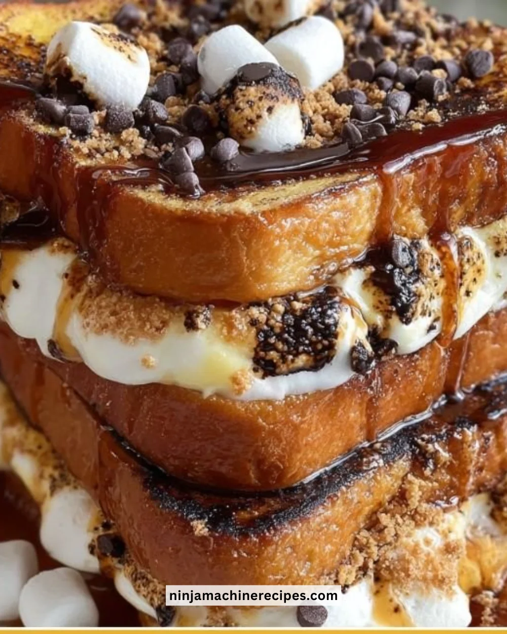 Delicious S’mores French Toast topped with marshmallows and chocolate syrup