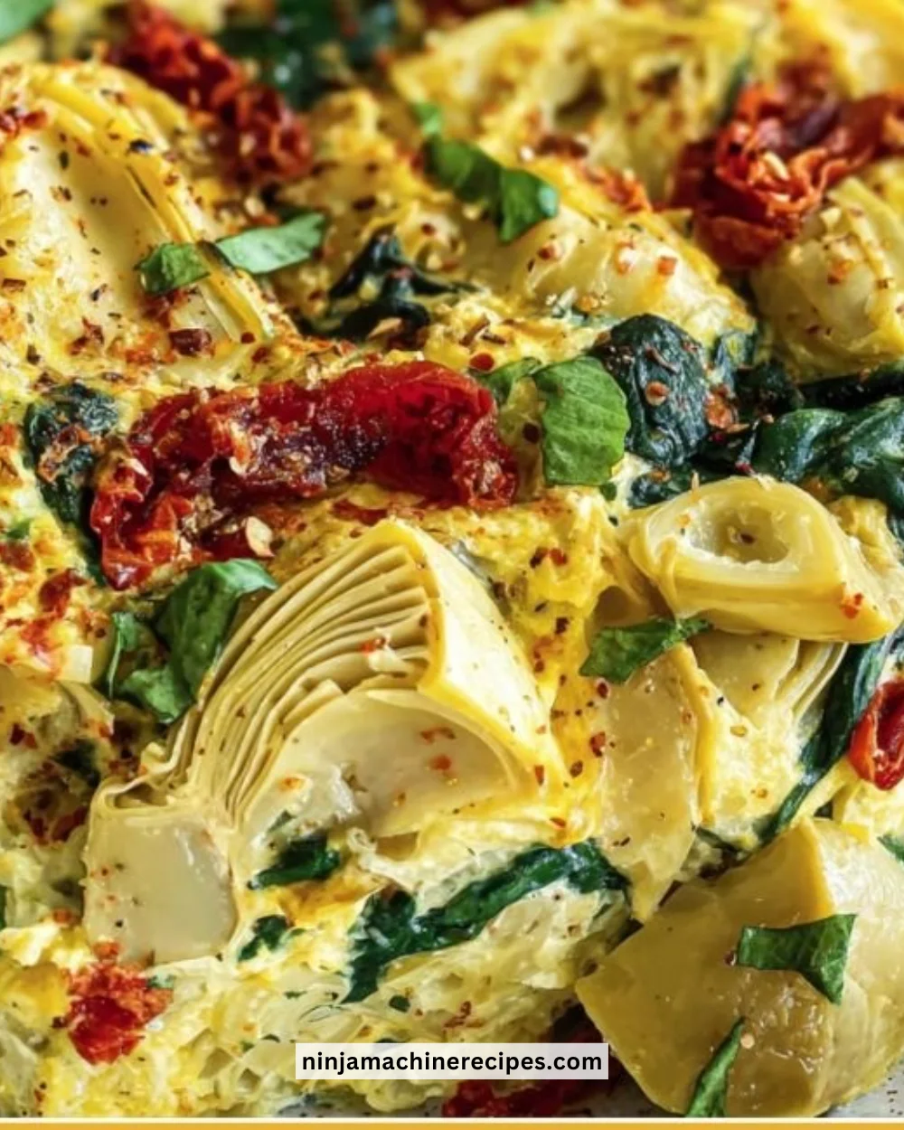 Spinach artichoke tomato casserole served in a baking dish
