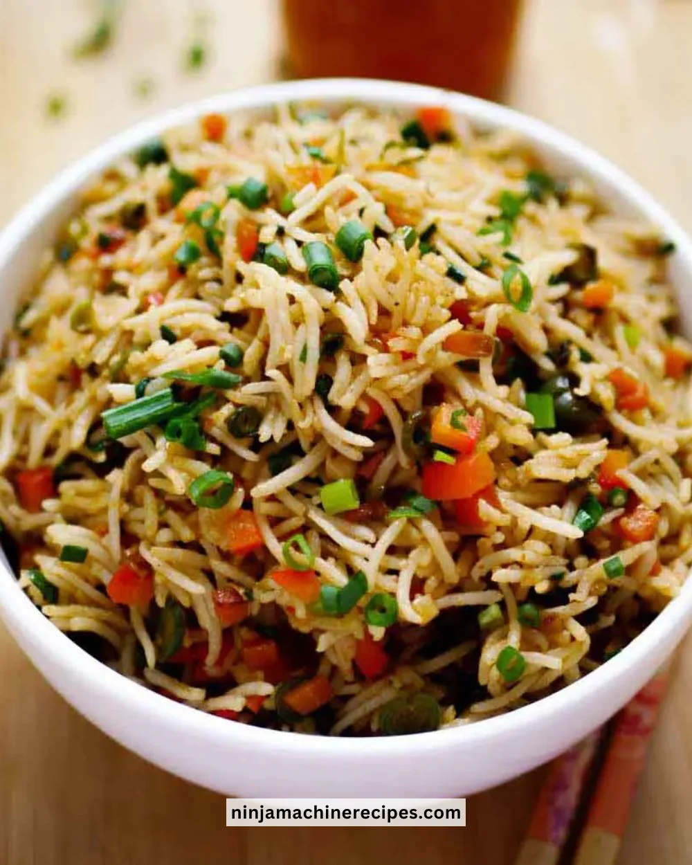 Plate of colorful Vegetable Fried Rice with fresh vegetables and herbs
