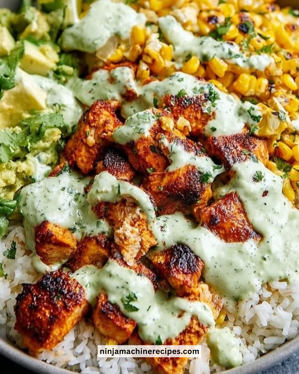 30-minute street corn chicken rice bowl garnished with fresh herbs
