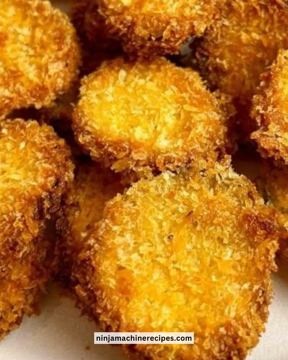 Crispy air fryer fried pickles served on a platter with dipping sauce