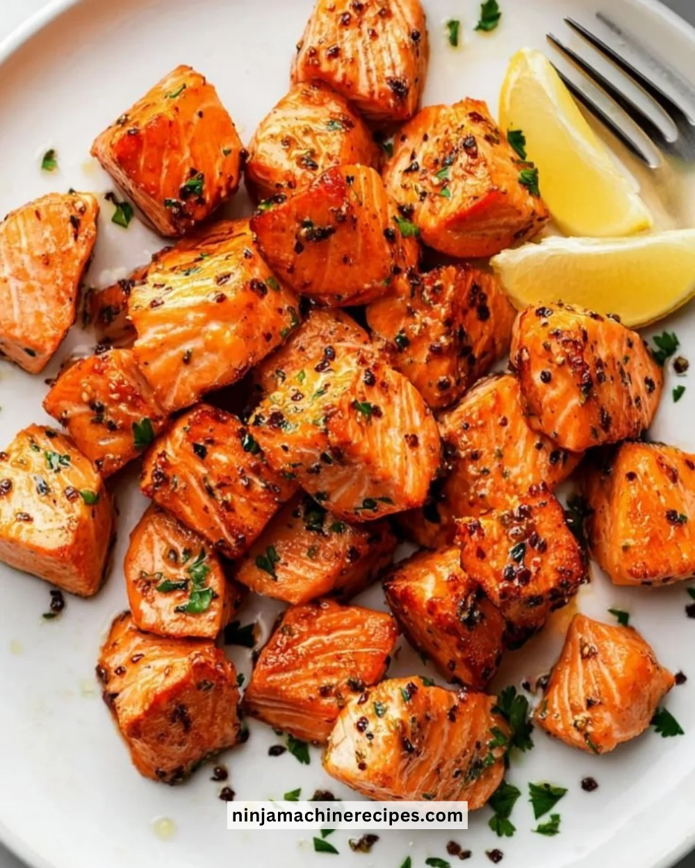 Plate of Air Fryer garlic butter salmon garnished with herbs