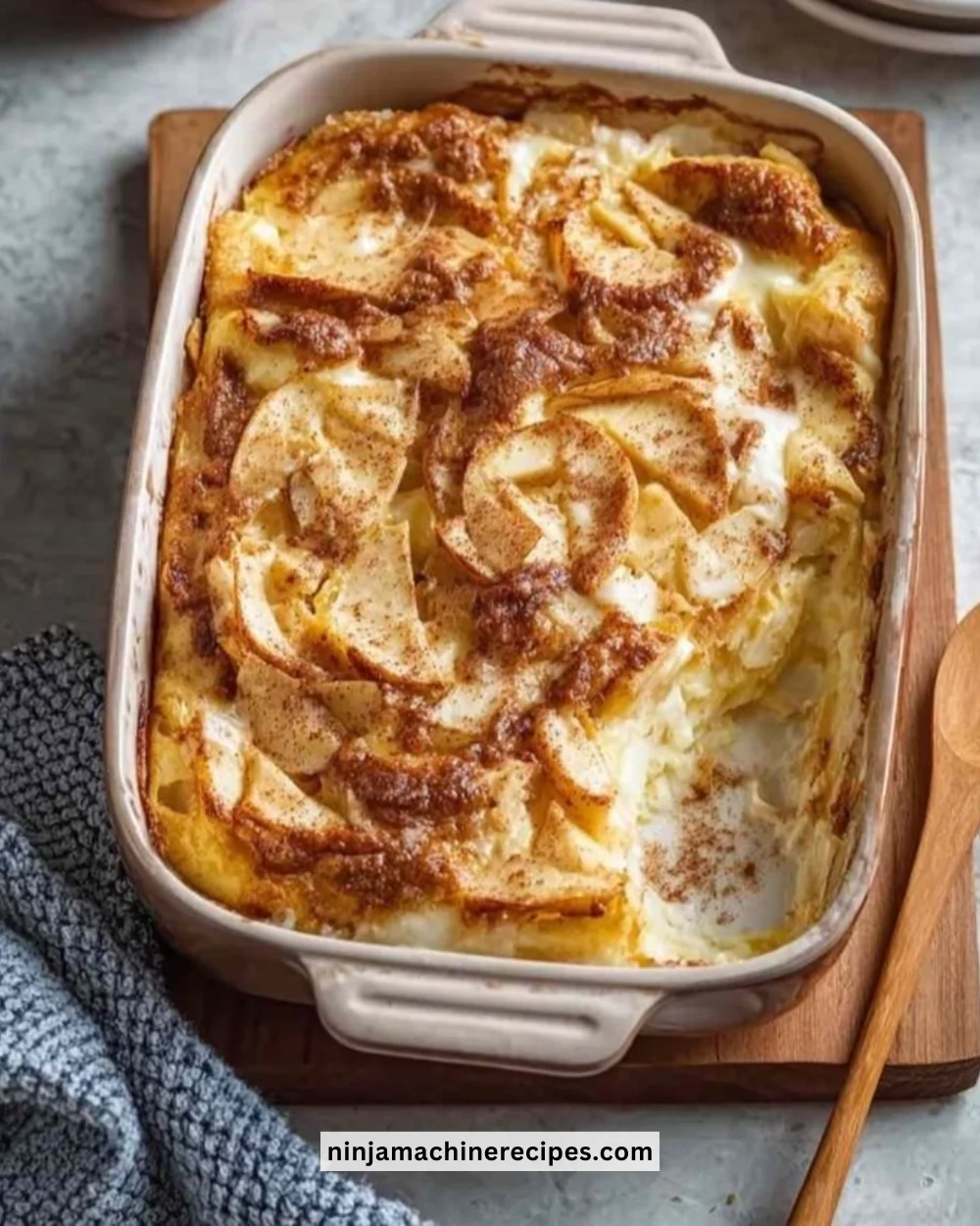 Apple Cinnamon Cottage Cheese Bake served in a dish garnished with cinnamon and apples