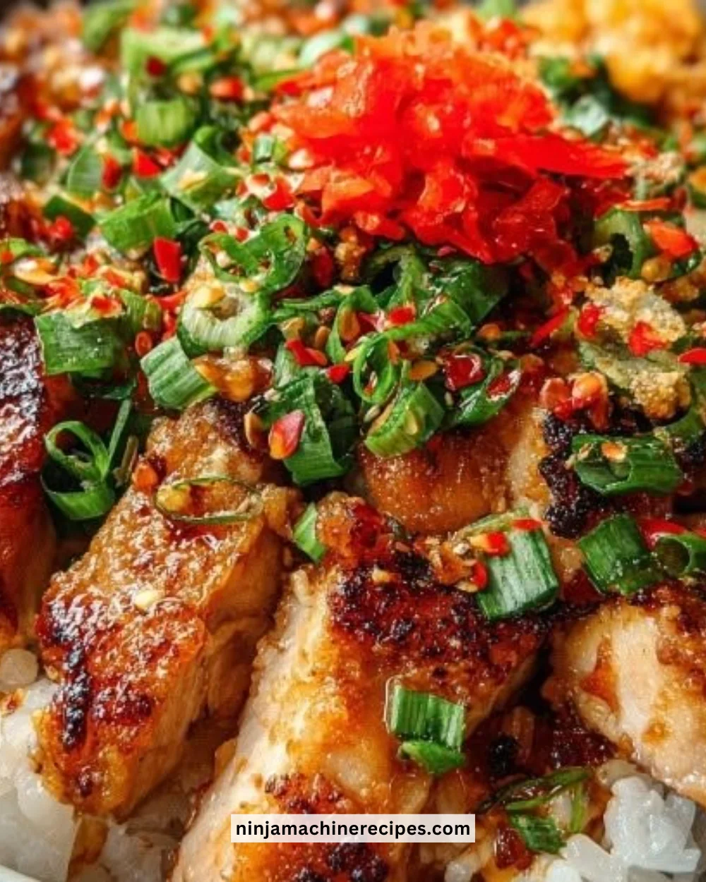 Delicious Bang Bang Chicken Bowl garnished with fresh herbs and colorful vegetables