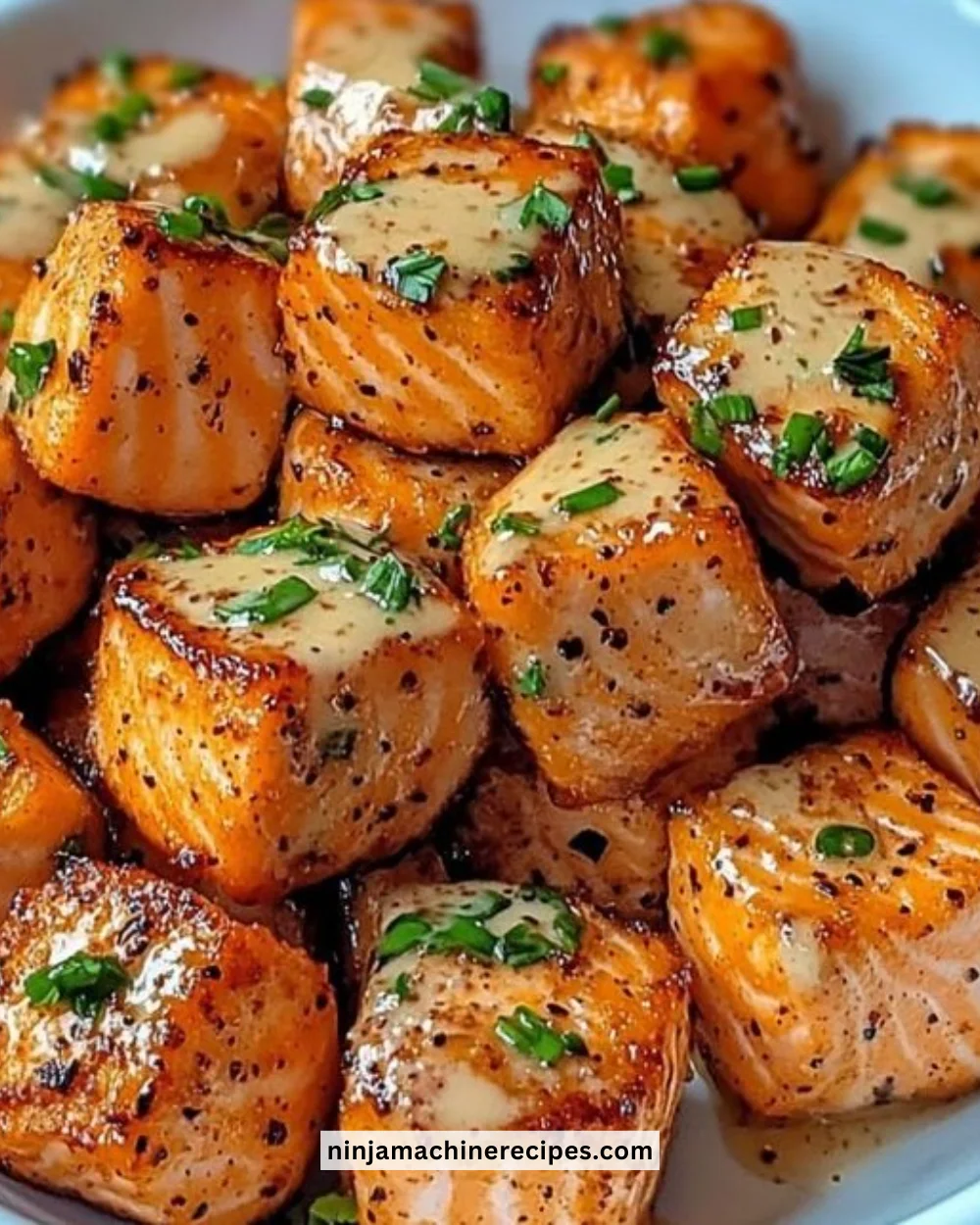 Plate of Bang Bang Salmon Bites served with dipping sauce