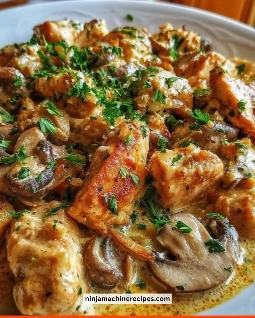 Delicious Chicken Mushroom Stroganoff served in a bowl with herbs garnish