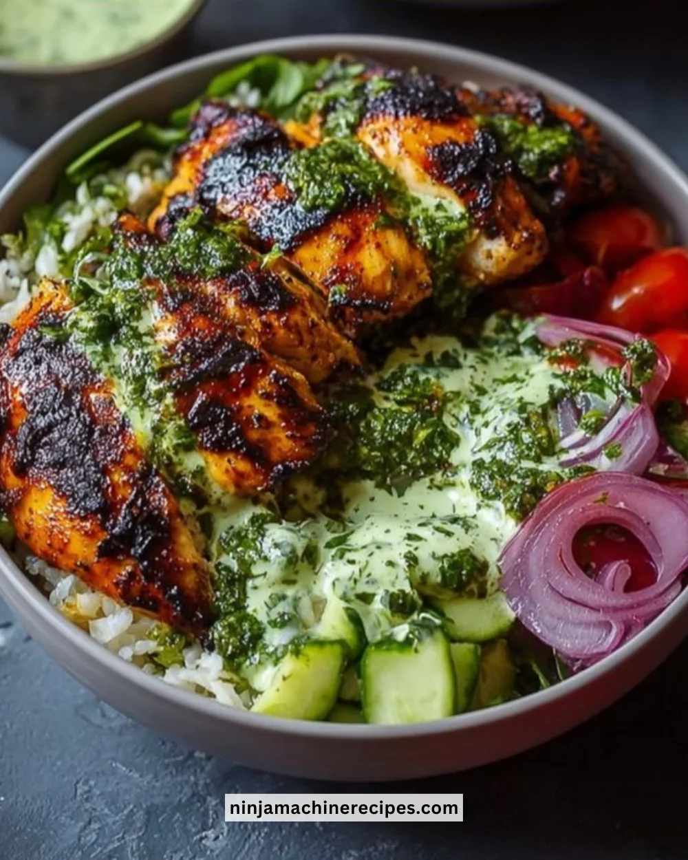 Chimichurri grilled chicken bowl with garlic sauce and fresh toppings