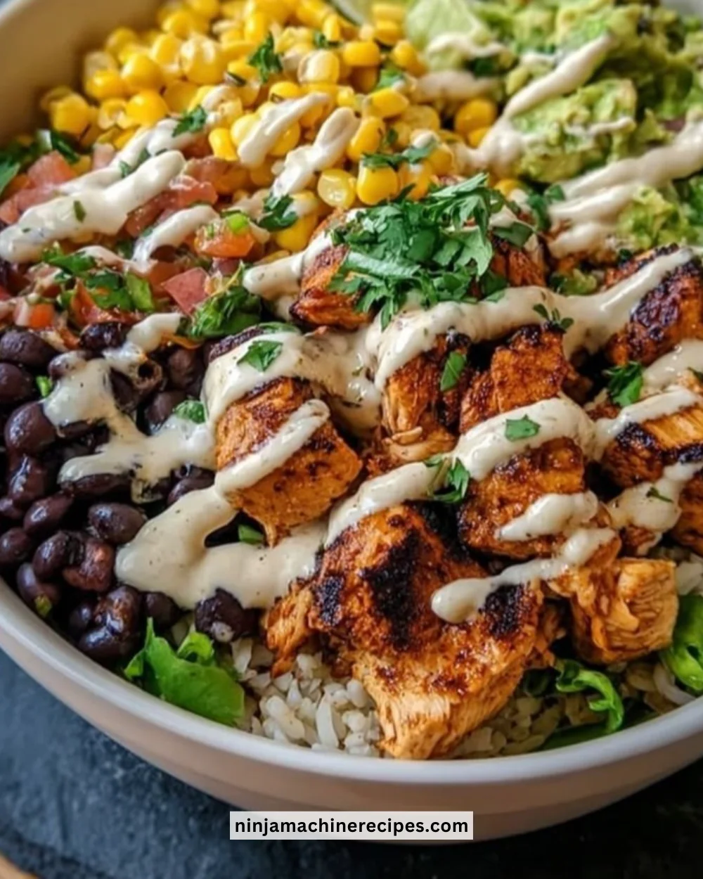 Chipotle Chicken Bowl featuring black beans, corn, and creamy sauce.