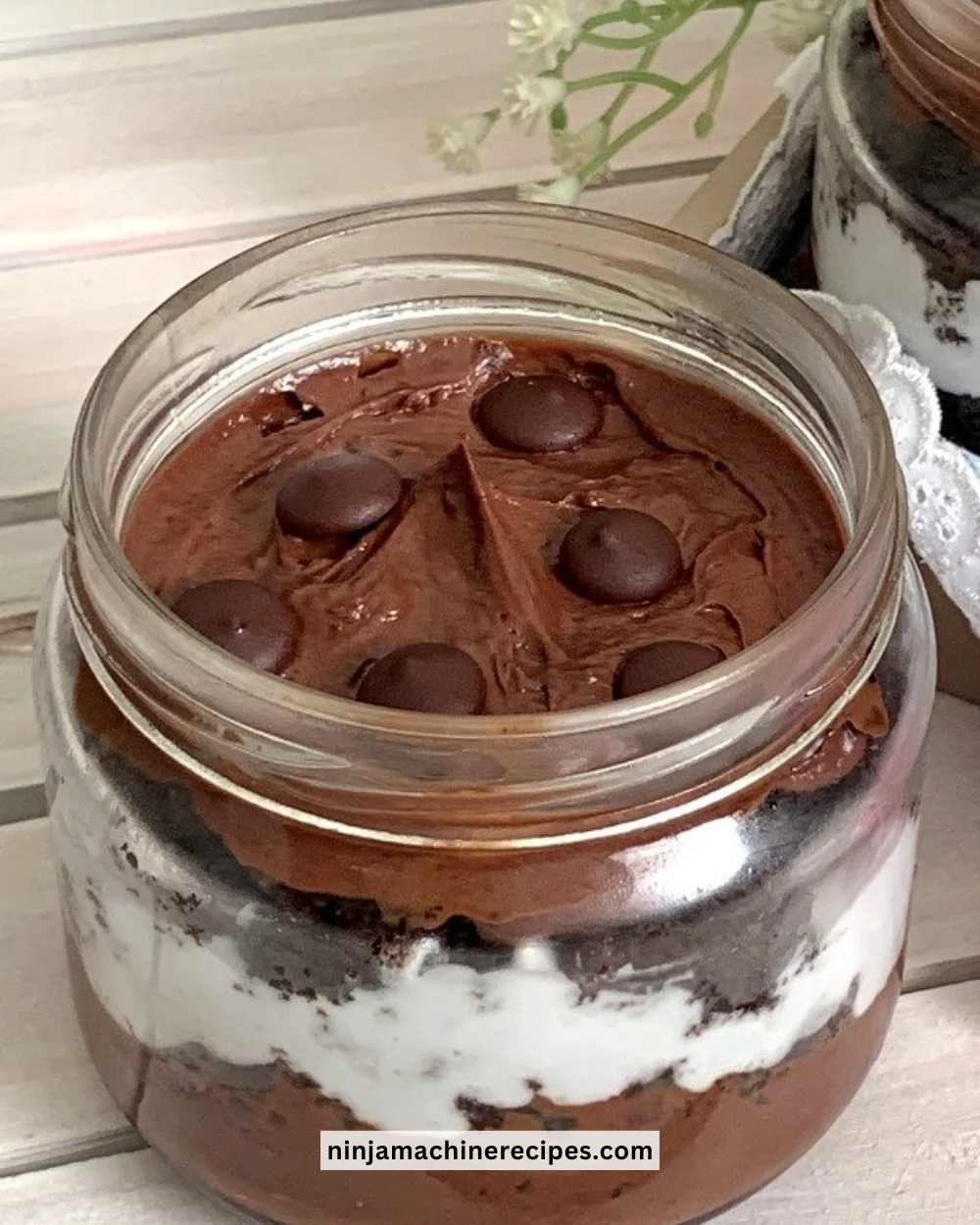 Decadent Chocolate Jar Cake layered with rich chocolate frosting in a jar