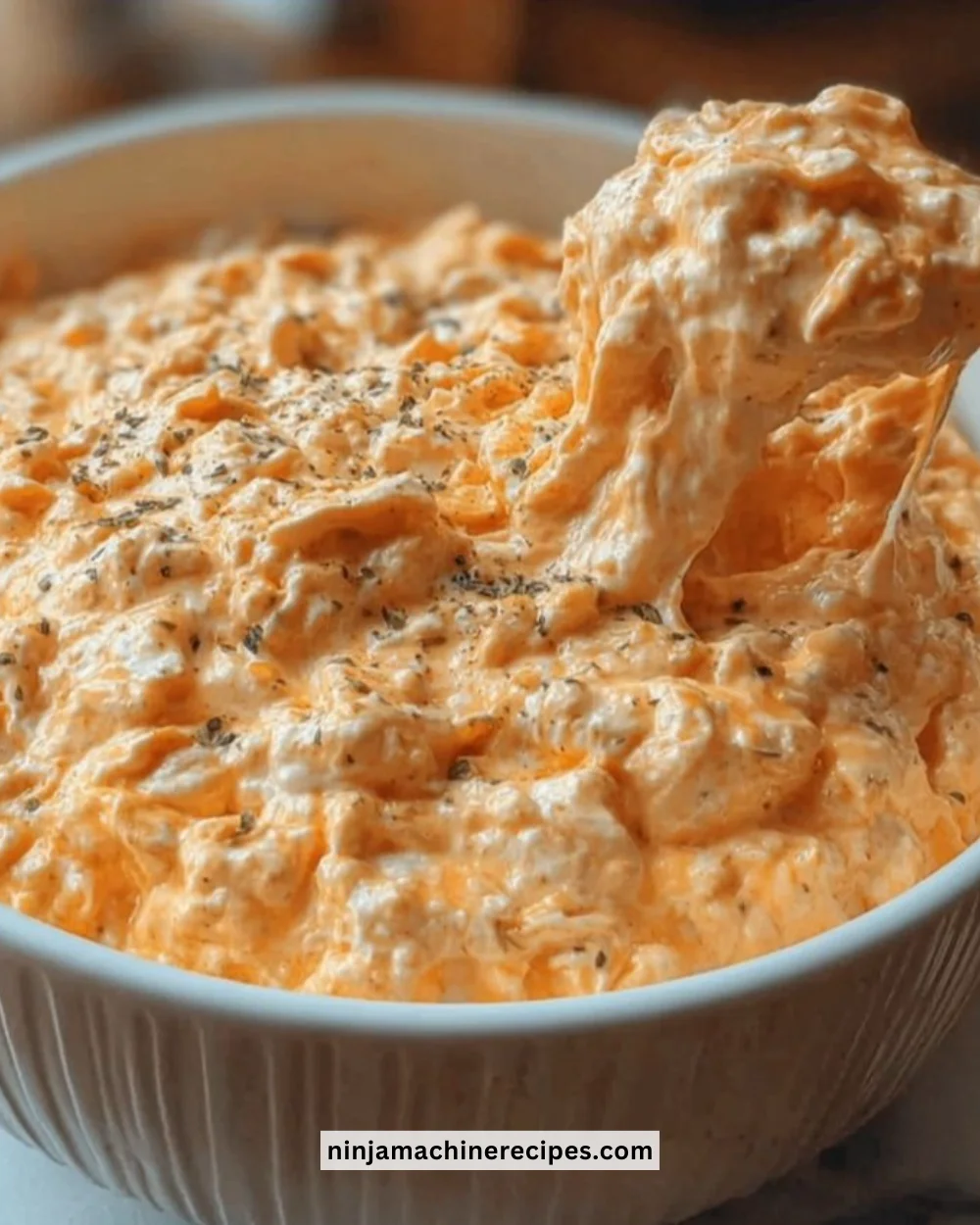 Cottage Cheese Buffalo Chicken Dip served in a bowl with tortilla chips