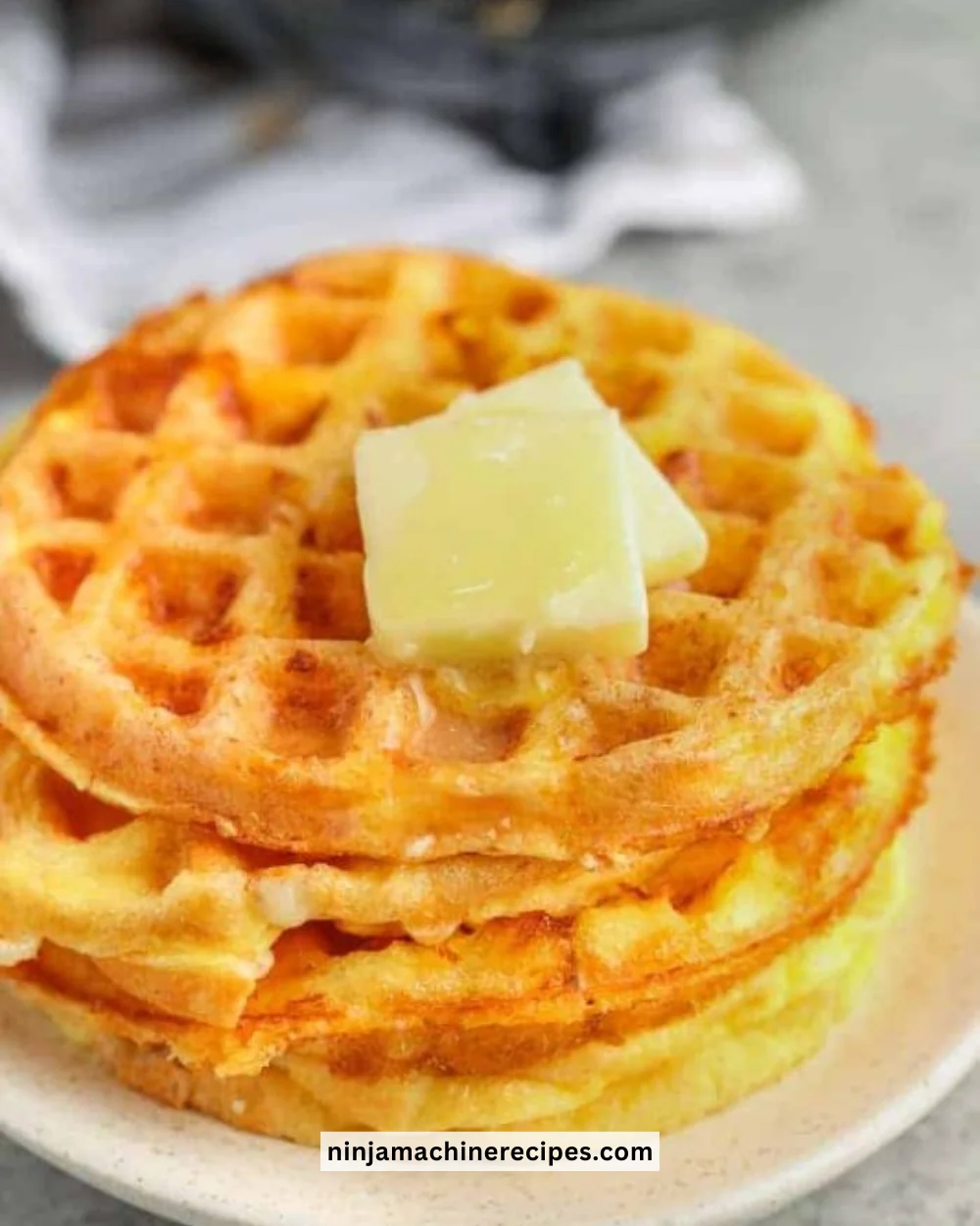 Easy recipe for cheesy and crispy chaffles served on a plate.