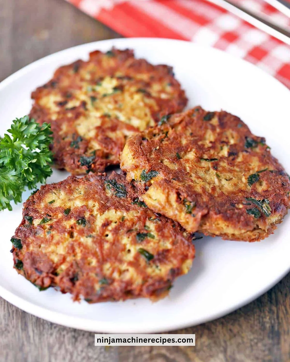 Delicious and healthy tuna patties served on a plate with garnish