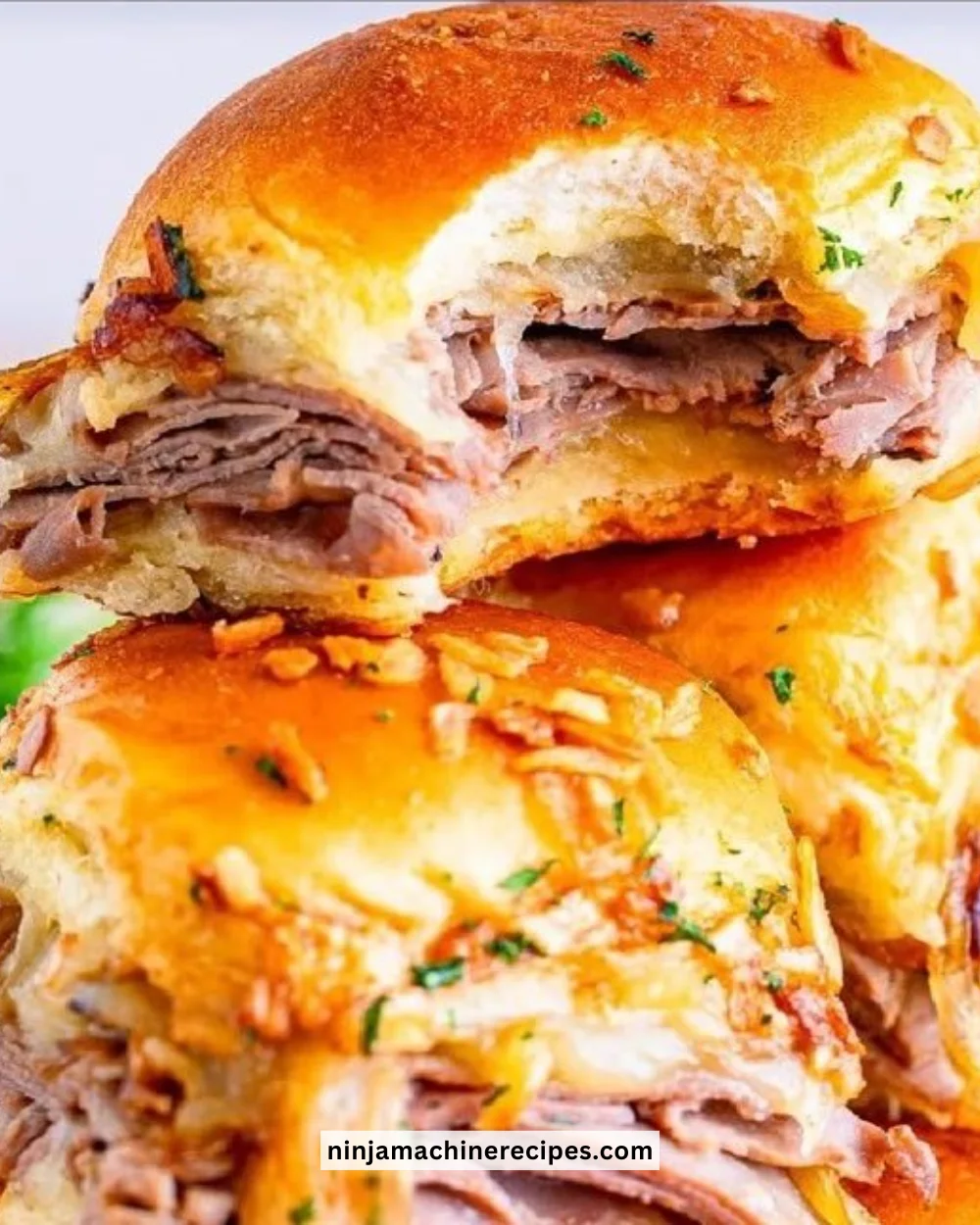 Delicious French Dip Sliders served with au jus for dipping