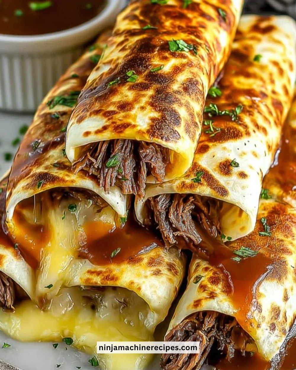 Delicious French Dip Tortilla Roll Ups served on a platter