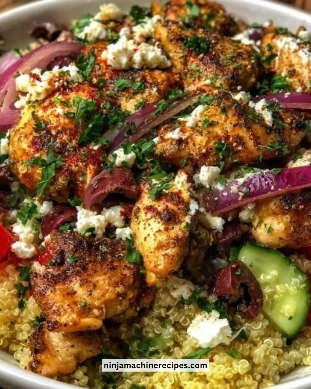 Delicious Greek Chicken Bowl featuring grilled chicken, veggies, and sauce.