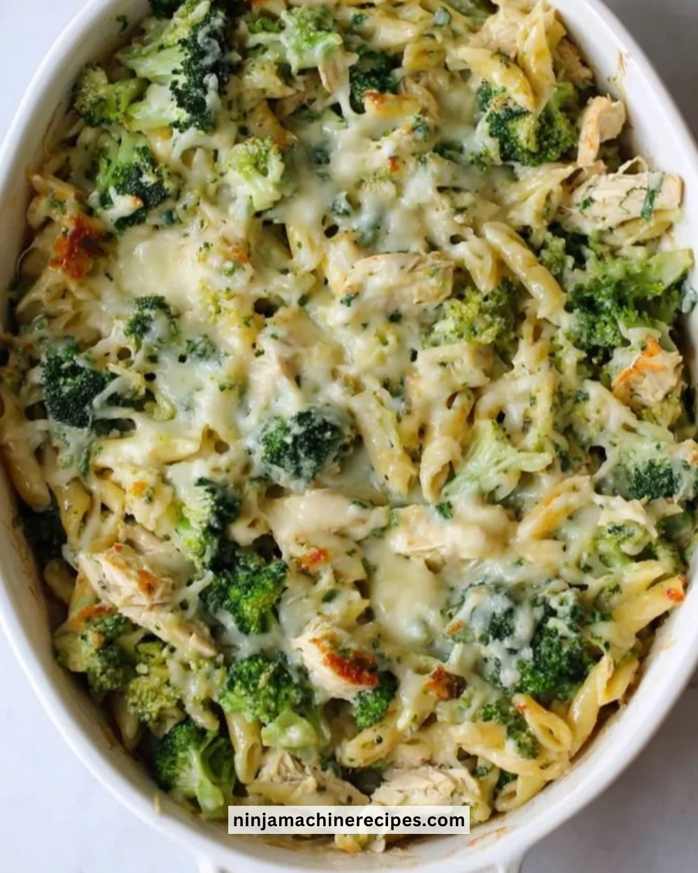 Delicious High Protein Alfredo Bake topped with cheese and herbs