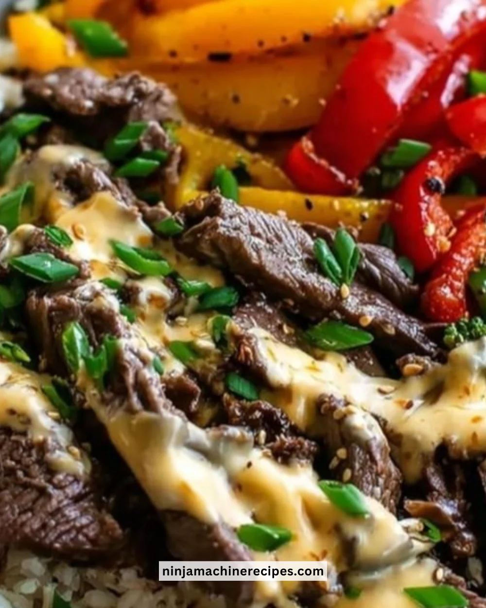 High protein Philly cheesesteak rice bowls topped with peppers and onions