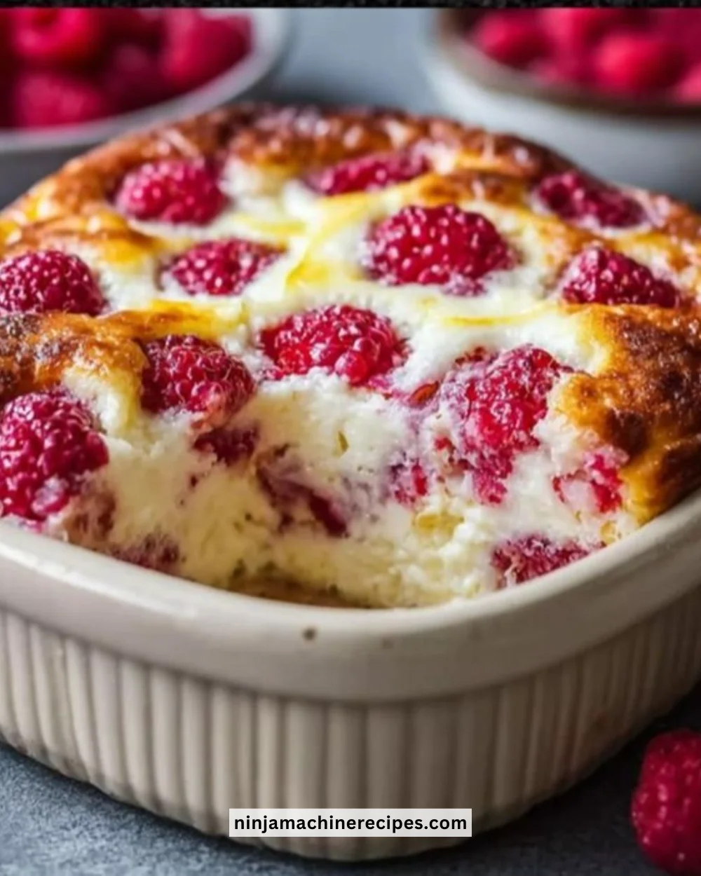 Delicious Lemon Raspberry Cottage Cheese Bake served on a plate with fresh raspberries.