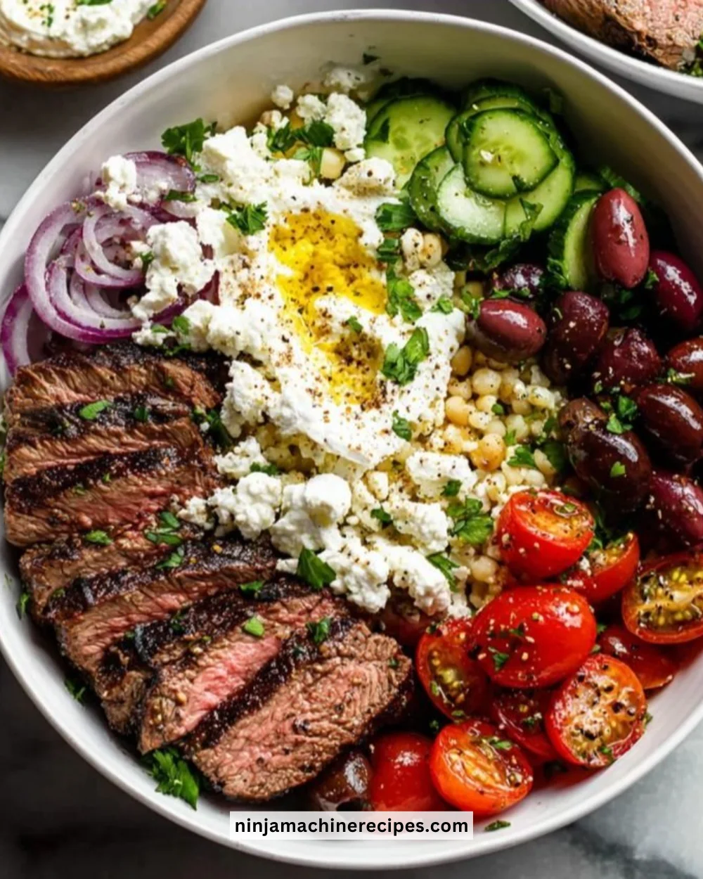 Mediterranean steak bowls with fresh vegetables and flavorful ingredients