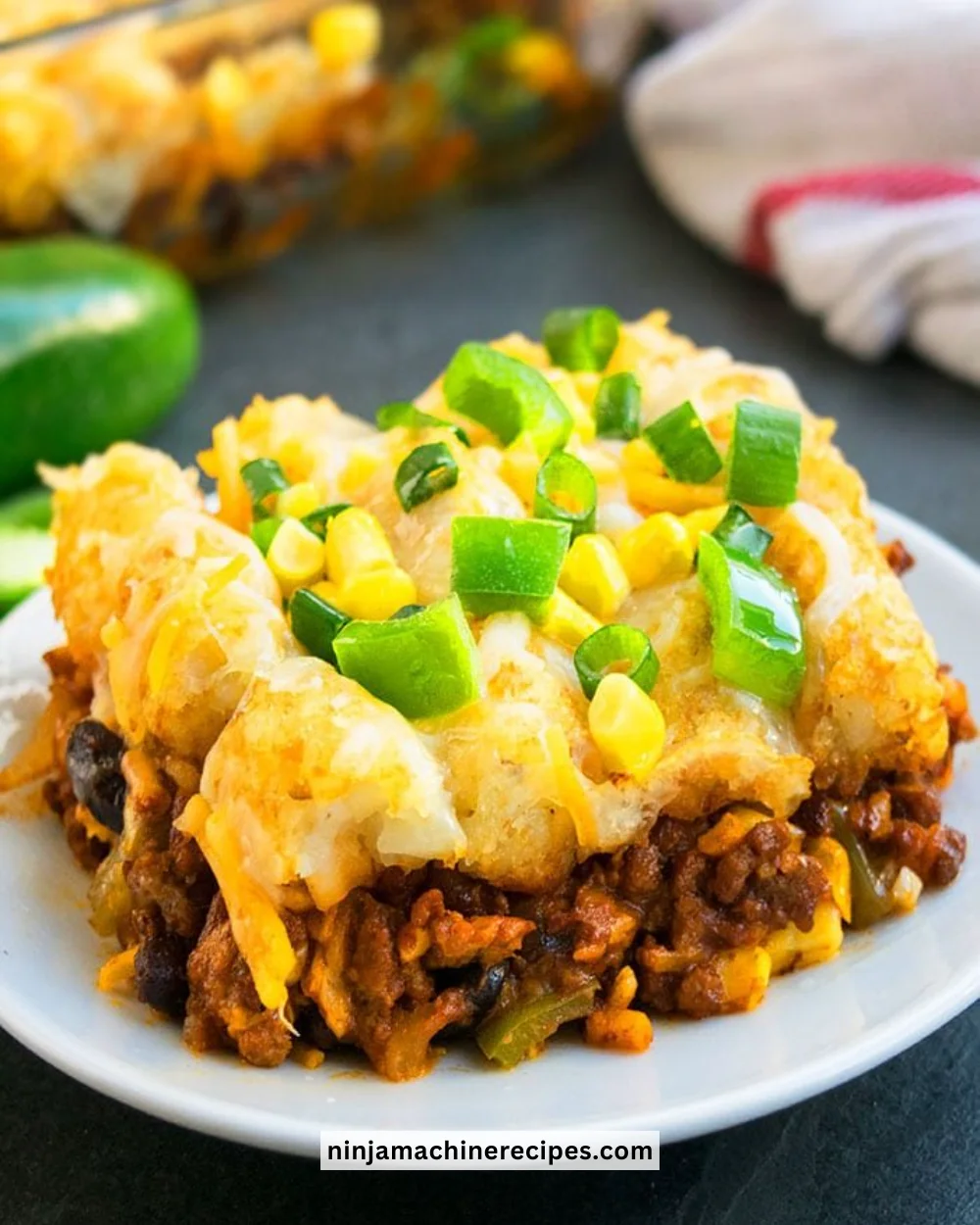 Delicious Mexican Tater Tot Casserole topped with cheese and spices
