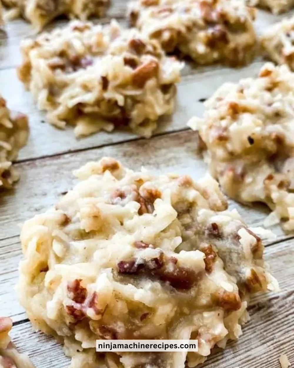 Batch of no-bake coconut praline cookies on a plate ready to be enjoyed.