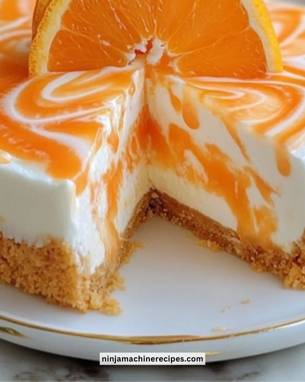 No-Bake Orange Creamsicle Cheesecake topped with orange slices and whipped cream