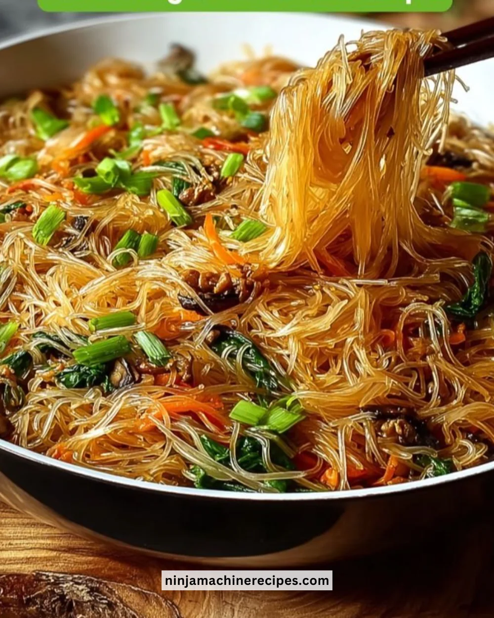 Colorful rice noodle stir-fry with fresh vegetables and herbs