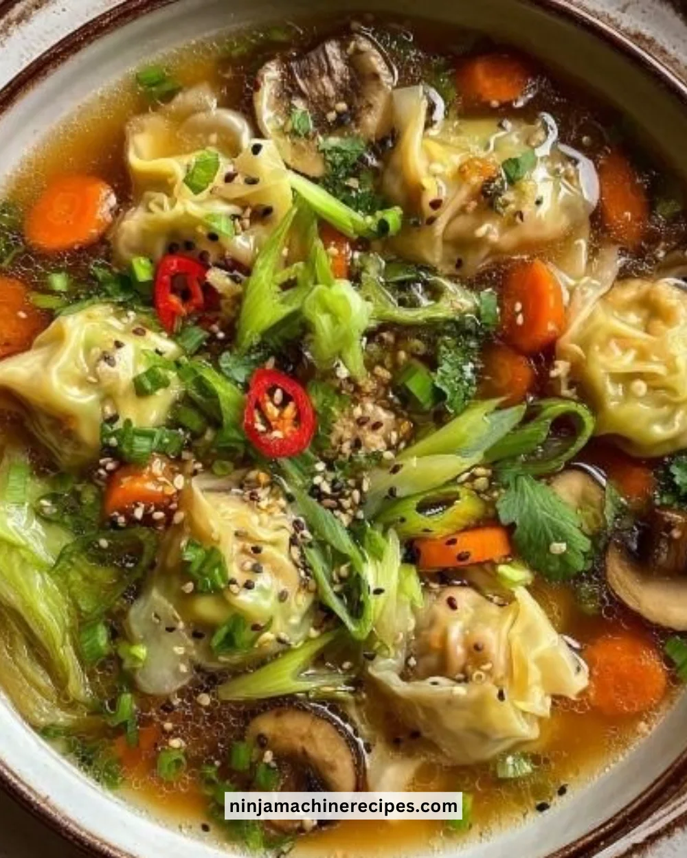 Savory wonton soup with delicate broth and fresh vegetables in a bowl