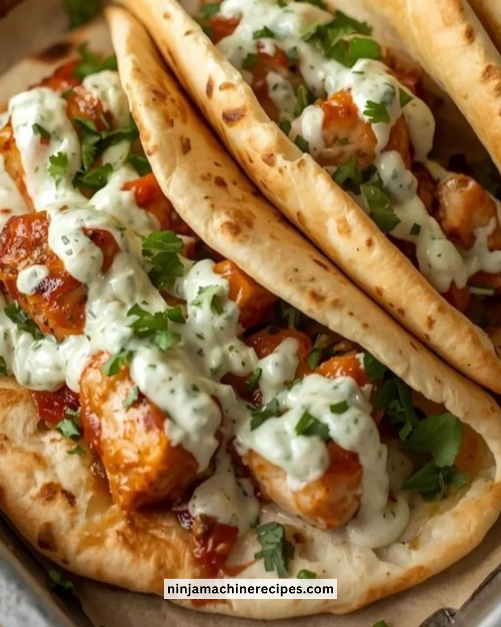 Sheet pan chicken pitas served with herby ranch dressing