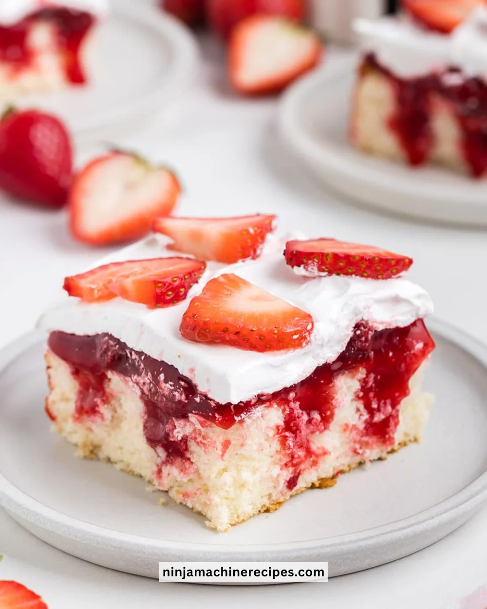 Strawberry Shortcake Poke Cake with fresh strawberries and whipped cream