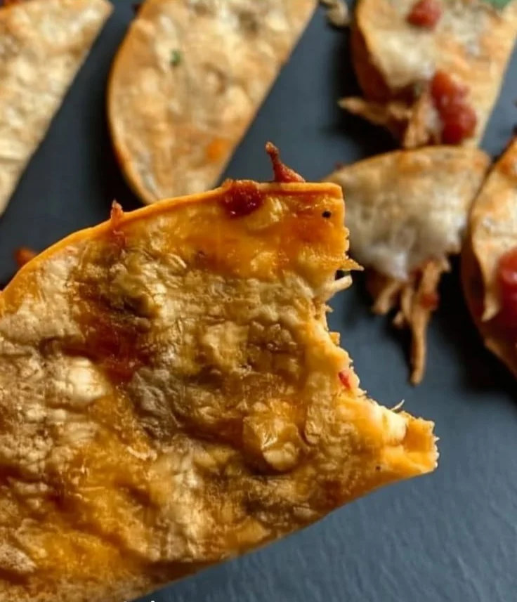 Baked chicken tacos served on a plate with fresh toppings