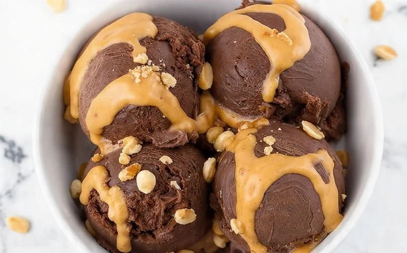 Delicious Chocolate Peanut Butter Protein Ice Cream in a bowl with toppings