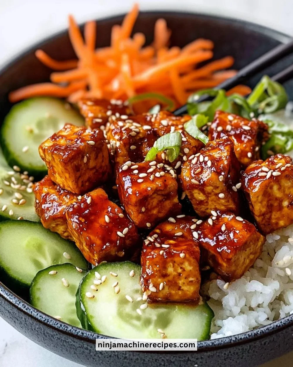 Crispy gochujang tofu dish garnished with vegetables.