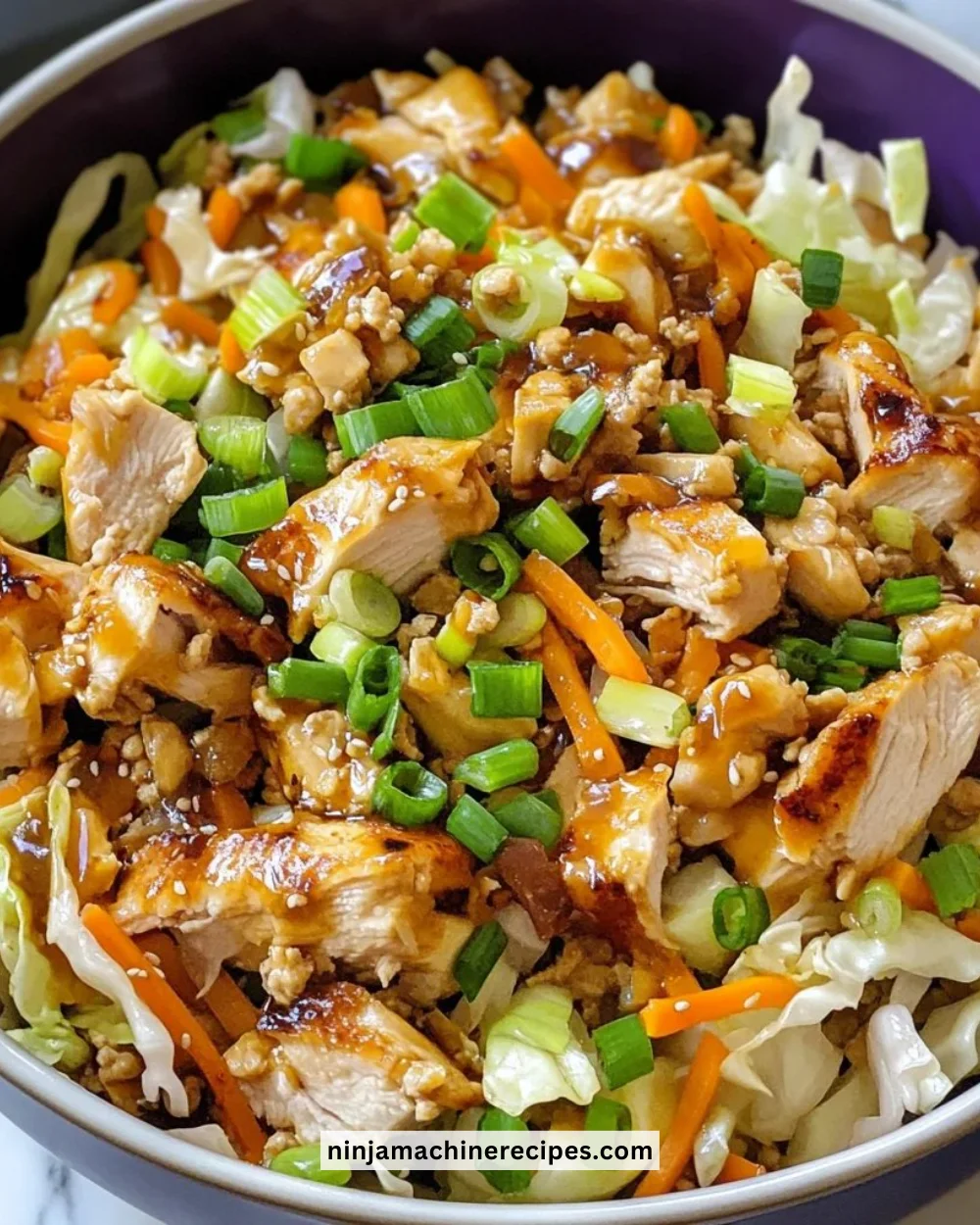 Delicious egg roll bowls with chicken, cabbage, and colorful vegetables