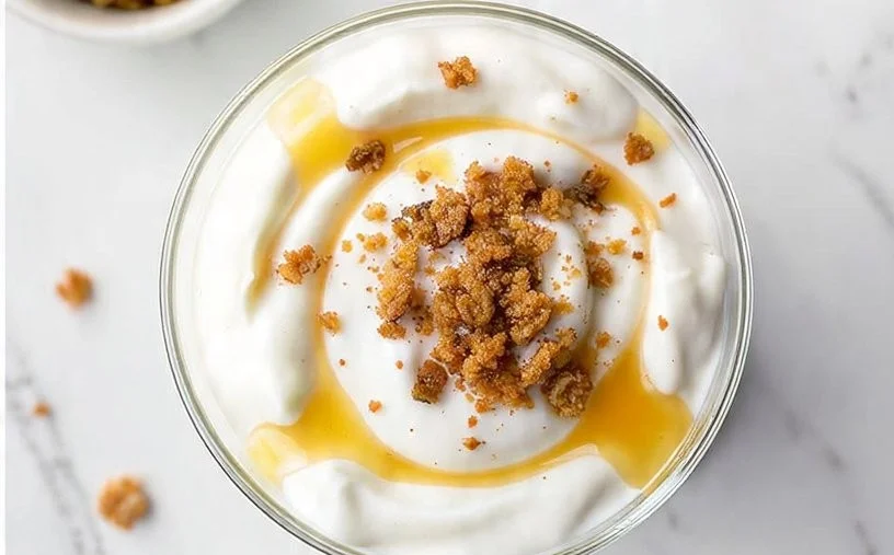 Greek Yogurt Ninja Creami served in a bowl, showcasing its creamy texture and toppings.