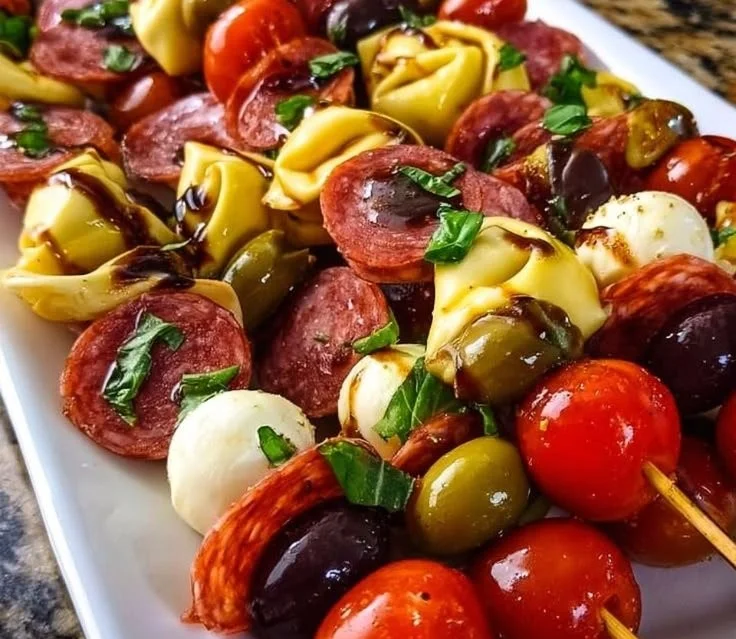Italian antipasto skewers featuring olives, cheese, and cured meats