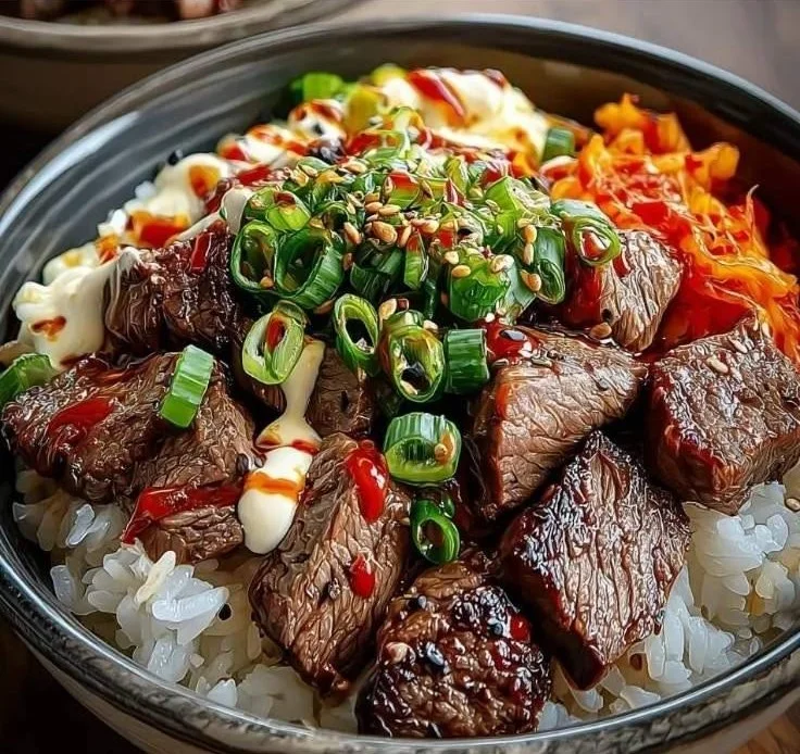 Korean BBQ steak rice bowl with grilled meat and vegetables