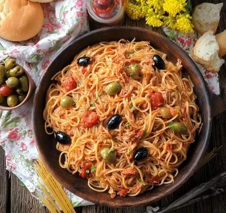 Plate of Linguine with Tuna Puttanesca featuring olives and capers