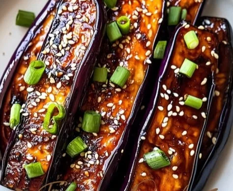 Delicious miso glazed eggplant served on a plate, showcasing its rich, flavorful sauce.